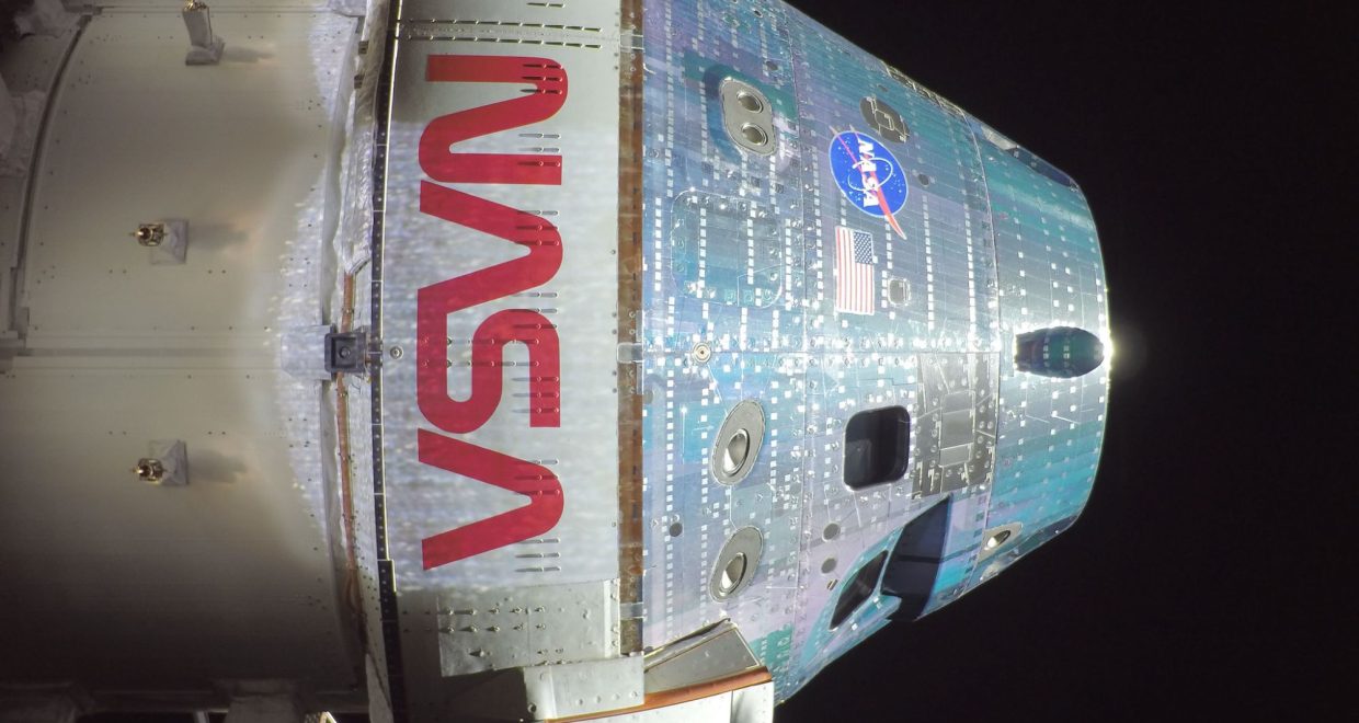 The Orion spacecraft with NASA logos visible on the way to the moon on Artemis 2 — Image credit: Artemis 2 astronauts - now halfway to the moon - report 'burning smell' from toilet, but everything's fine / https://www.space.com/author/tariq-malik